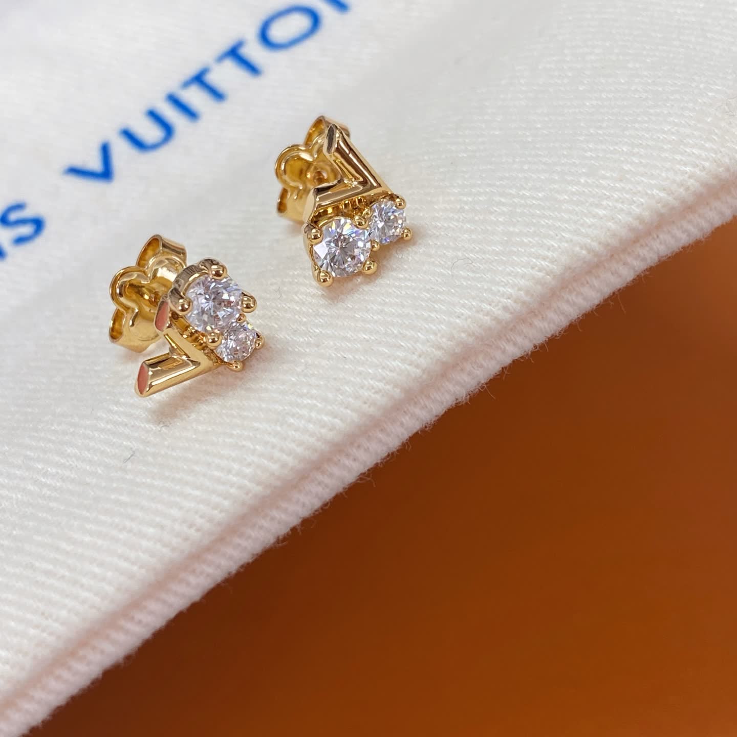 Louis Vuitton Gold Tone Stud Earrings with Clear Stones